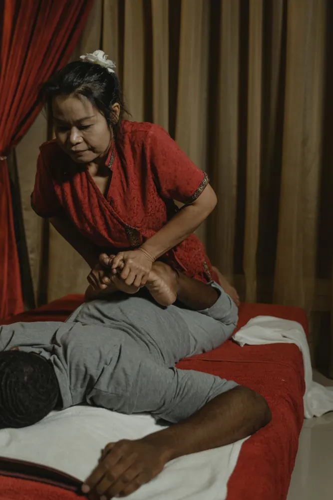 Male client receiving a clothed spa treatment