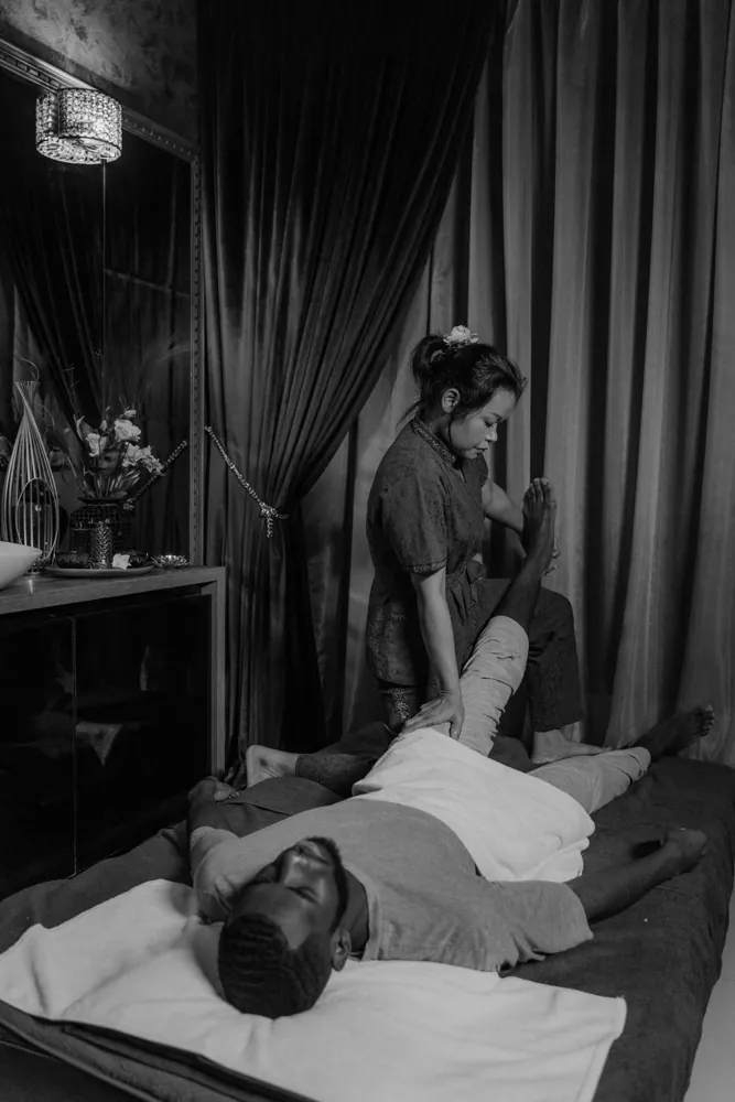 Monochrome spa treatment scene with an adult client